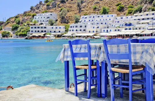 Blue chairs by the sea in Irakleion
